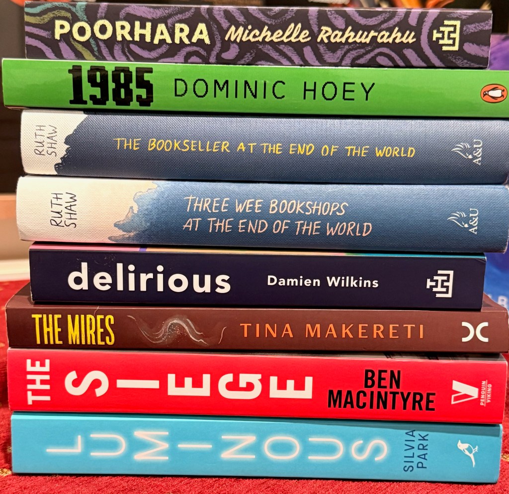 Stack of paperback and hardback books.